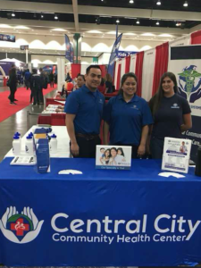 The staff at Central City Community in the booth at Telemundo Event 